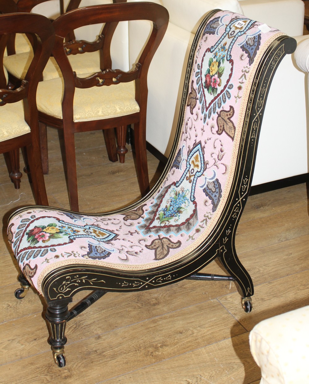 A late Victorian beadwork slipper chair, with polychrome beadwork upholstery